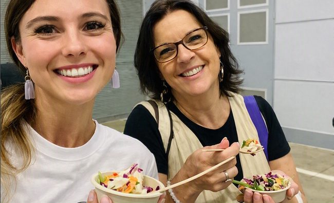 Kelly and Lydia from the CitiReach team smiling at a community event